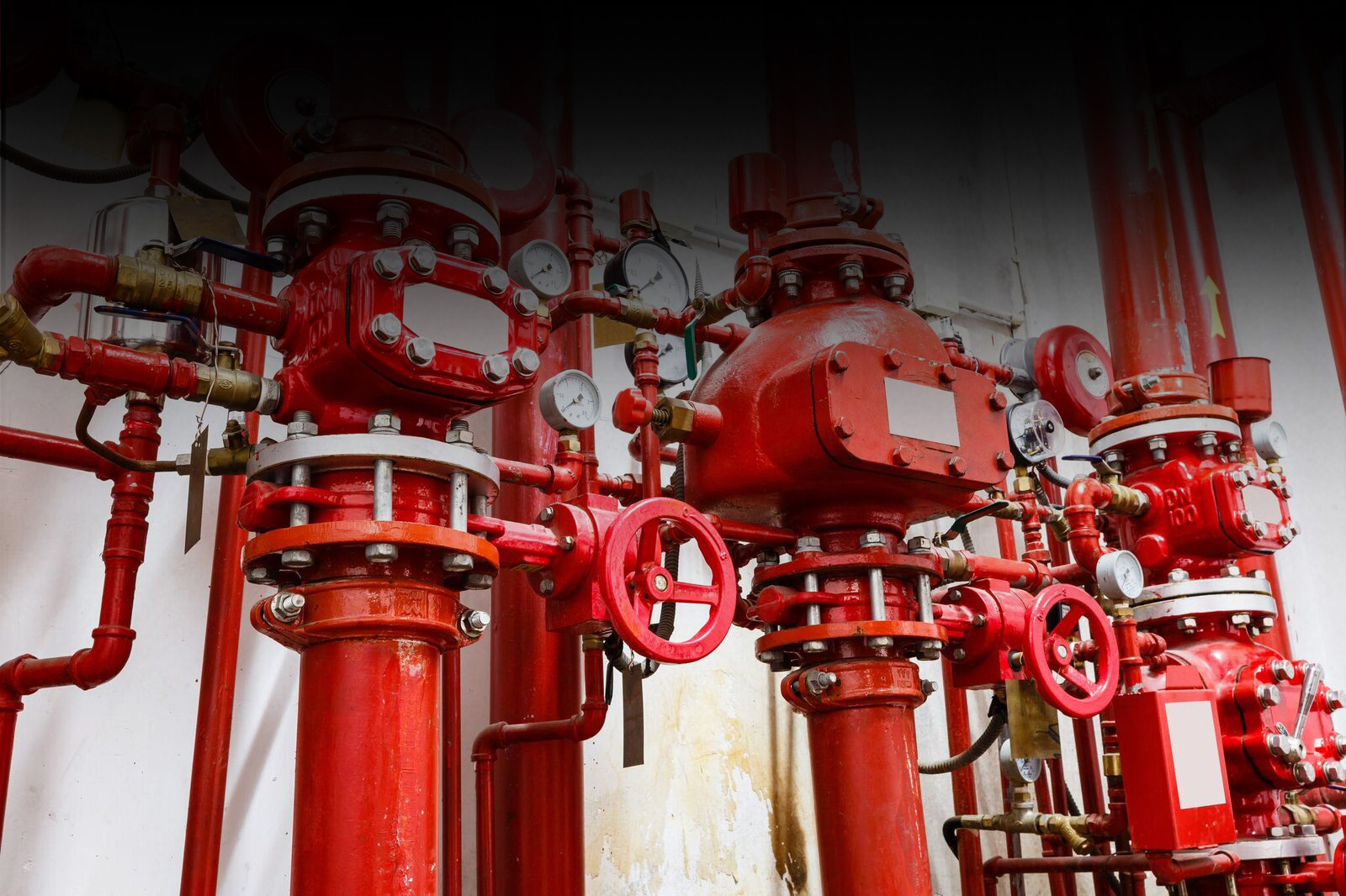Red fire hydrant valves and valves in a building - essential safety equipment for fire prevention and control.