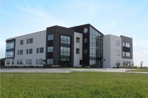 A contemporary office building with numerous windows, offering a sleek and professional atmosphere.