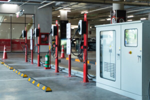 A series of Electric Vehicle Chargers in an indoor parking garage.