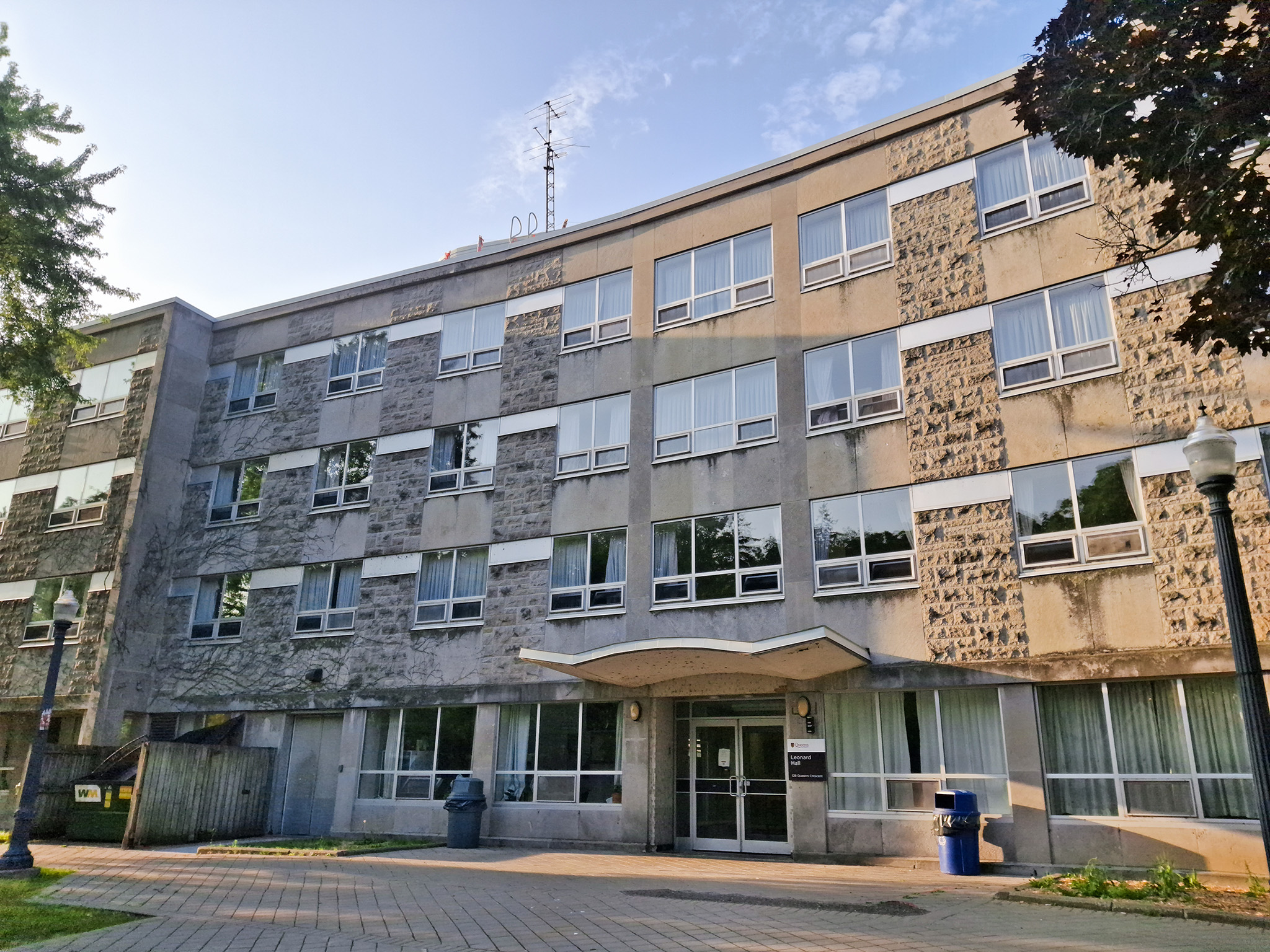 Leonard Hall 1 Front view of Leonard Hall, a four-storey academic building at Queen’s University with stone and concrete façade, large windows, and a central entrance.