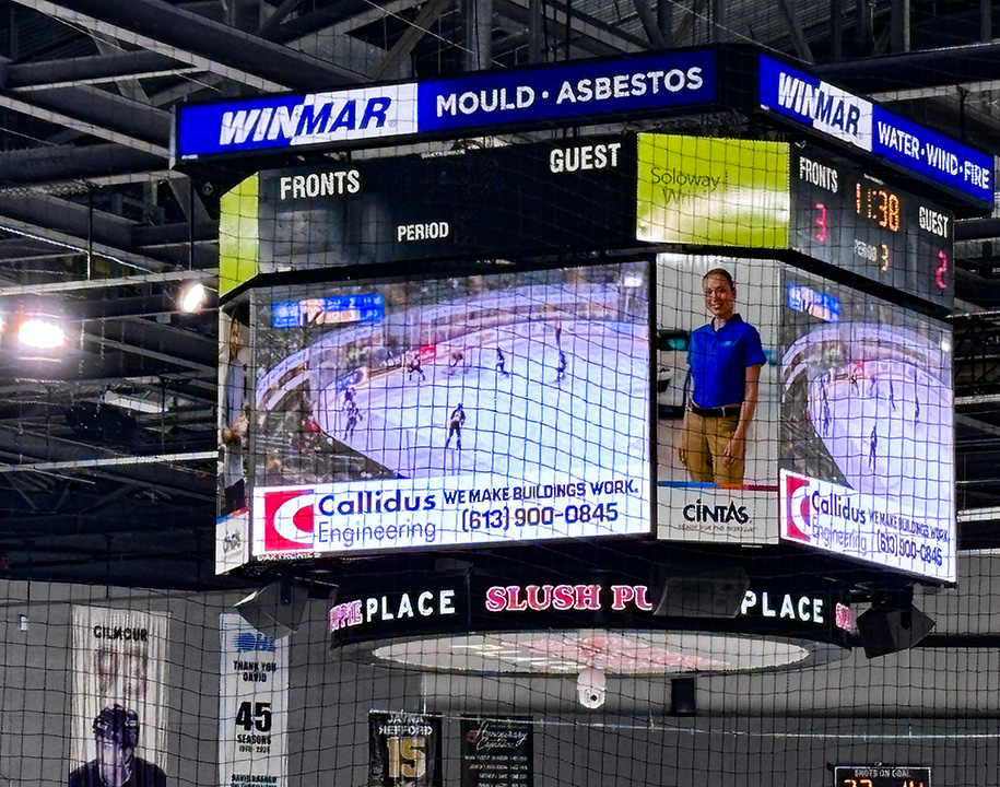 Callidus Engineering “We Make Buildings Work” ad on arena scoreboard during Kingston Frontenacs game