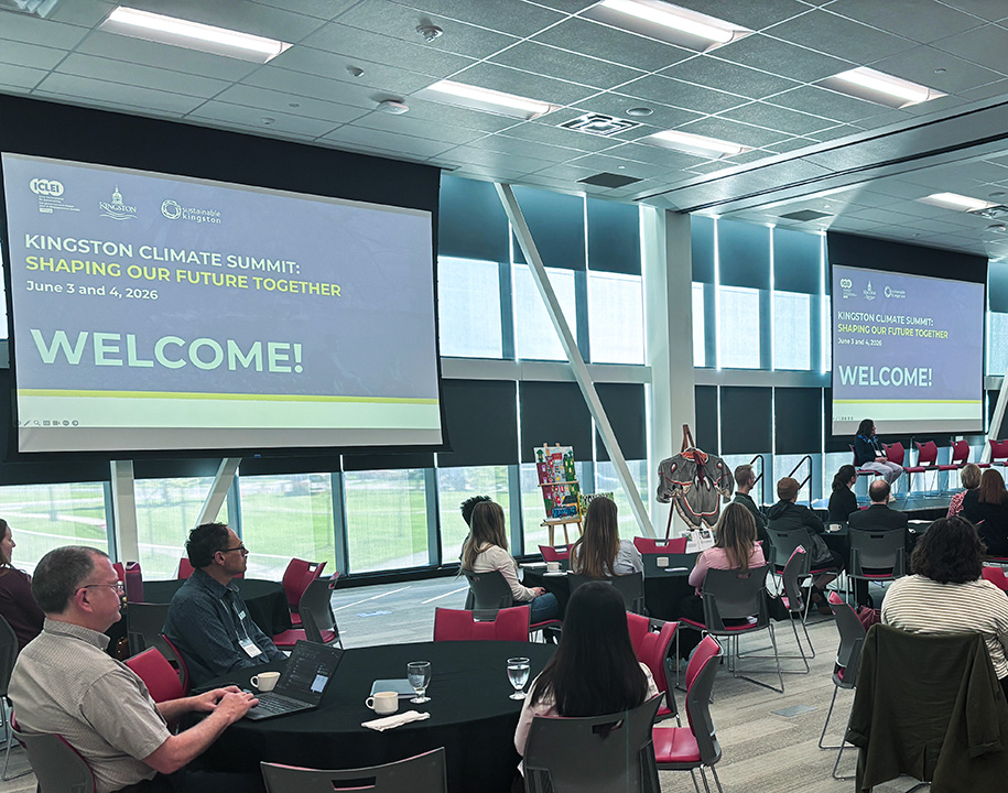 Welcome session for the 2026 Kingston Climate Summit at St. Lawrence College, with attendees seated facing the stage.
