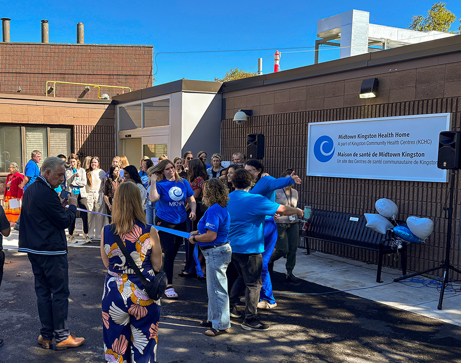 Attendees gather for a ribbon-cutting ceremony outside Midtown Kingston Health Home in Kingston.